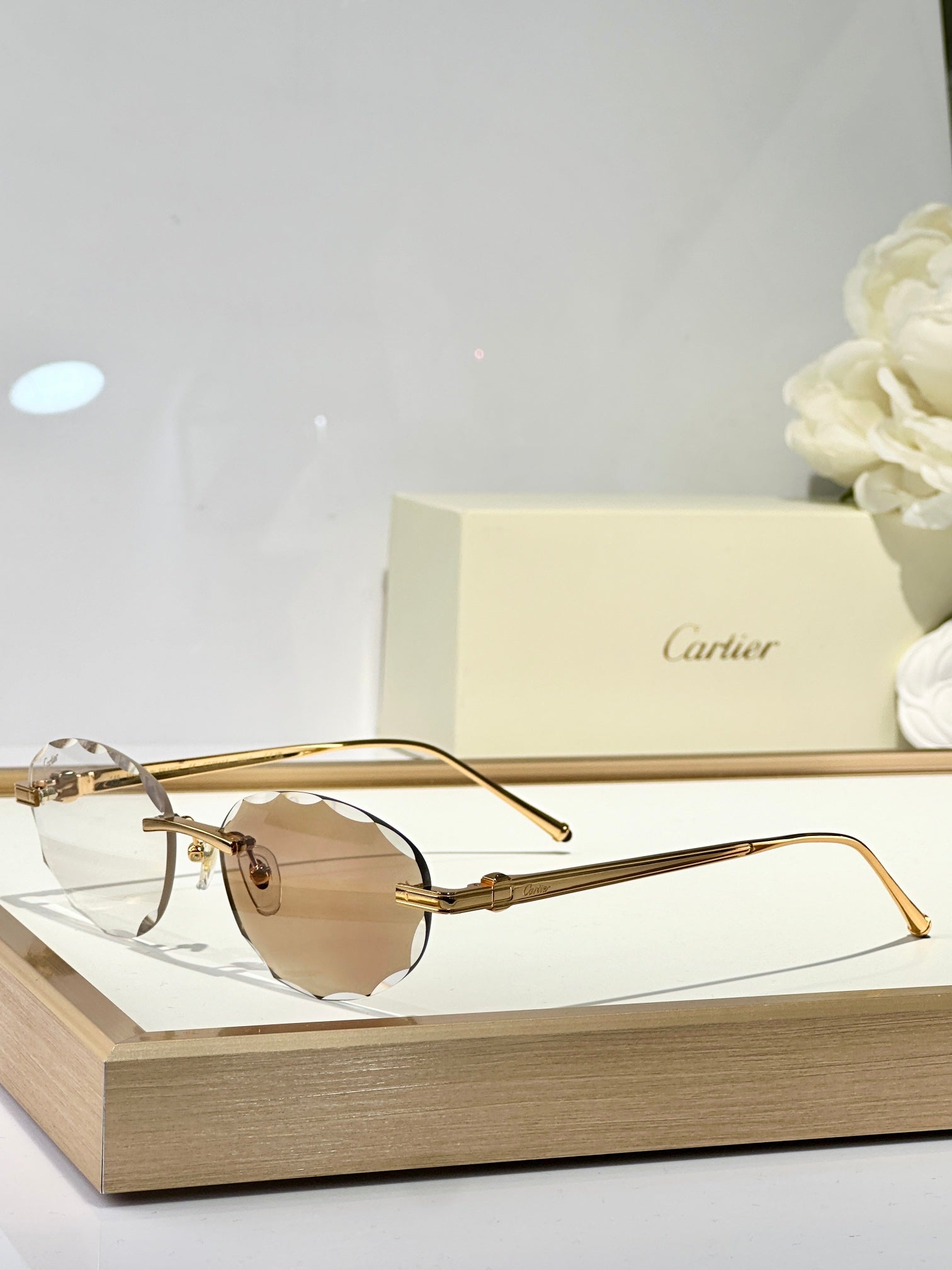 C DE RIMLESS ROUND FRAME SUNGLASSES CT0611S IN METAL