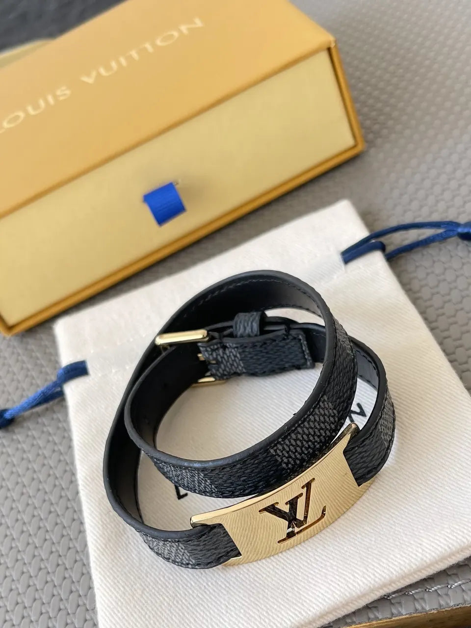Luxury LV Damier Ebene Leather Bracelet on wrist - Hình 3