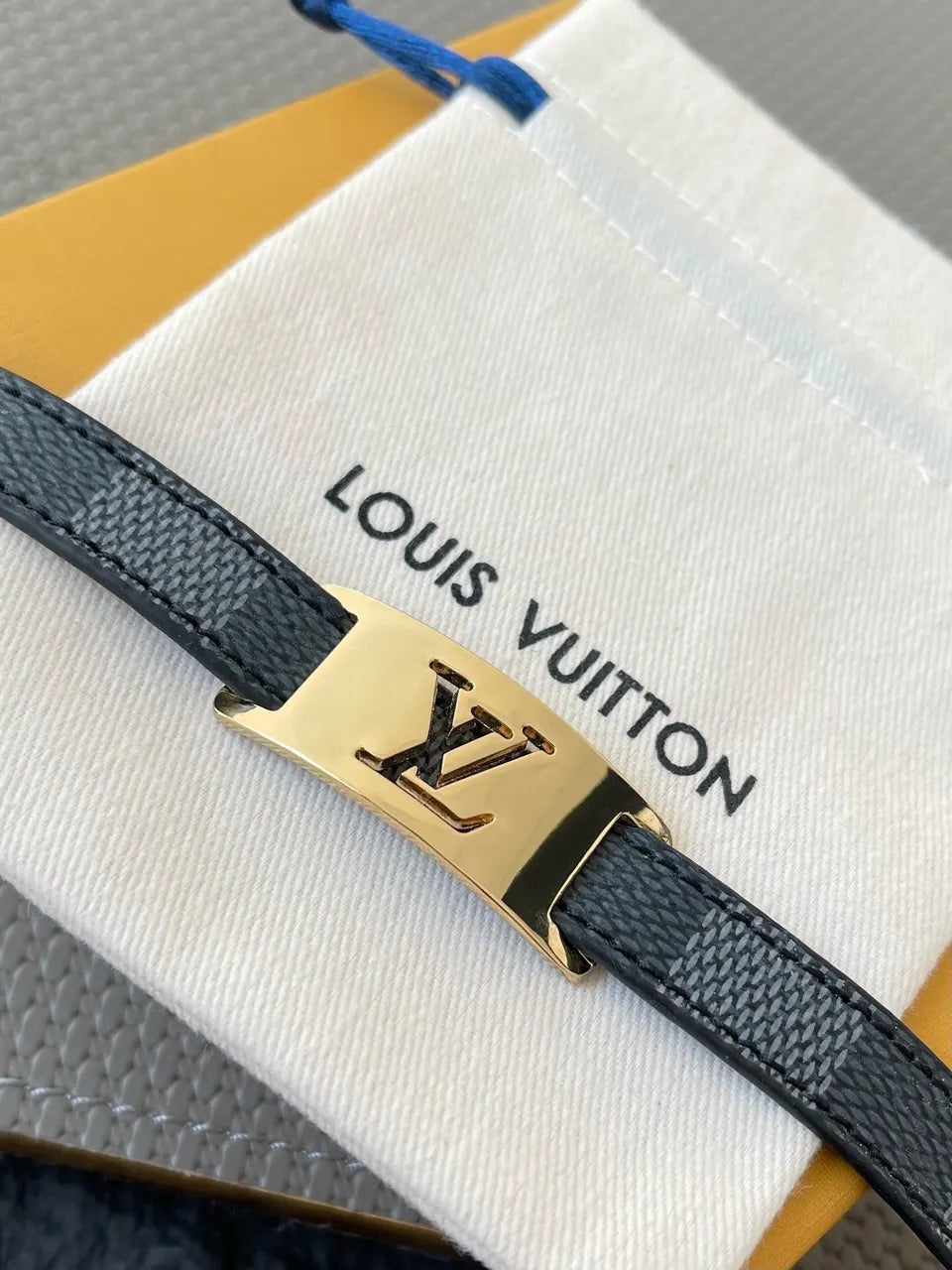 Luxury LV Damier Ebene Leather Bracelet on wrist - Hình 4