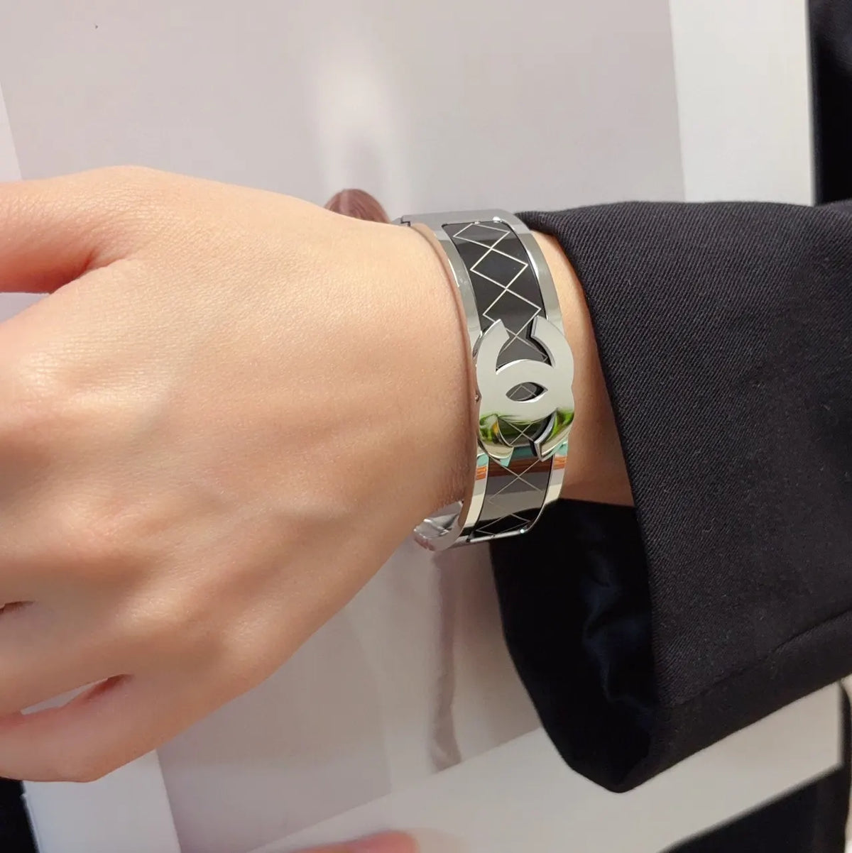Silver-Tone Logo Bracelet on Wrist - Hình 2