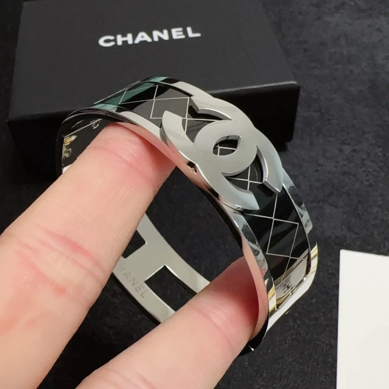 Silver-Tone Logo Bracelet on Wrist - Hình 8